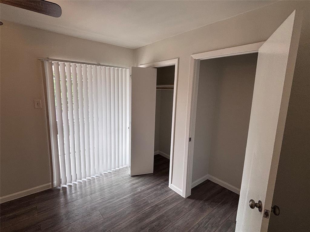 4300 Congress Avenue, Unit 216 Dallas, TX 75219 - Photo 8 of 13 an empty room with wooden floor and closet