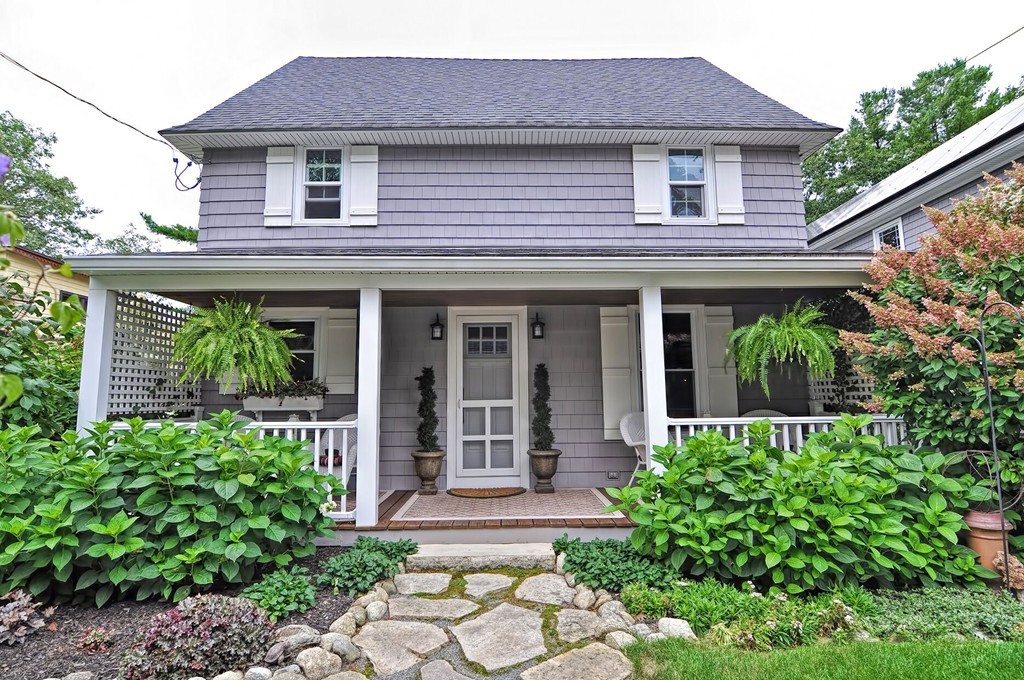 63 Wawela Park Road Webster, MA 01570 - Photo 1 of 30 a front view of a house with garden