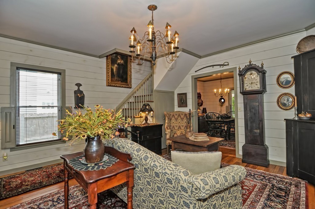 63 Wawela Park Road Webster, MA 01570 - Photo 18 of 30 a living room with furniture a chandelier and a rug