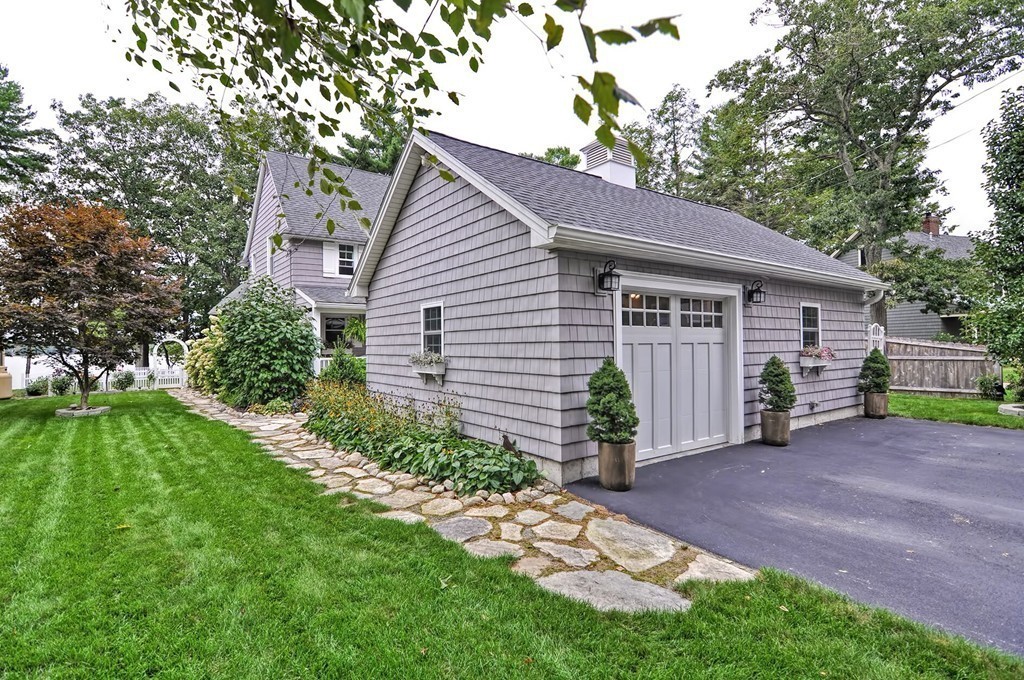 63 Wawela Park Road Webster, MA 01570 - Photo 2 of 30 a view of a house with a yard and potted plants