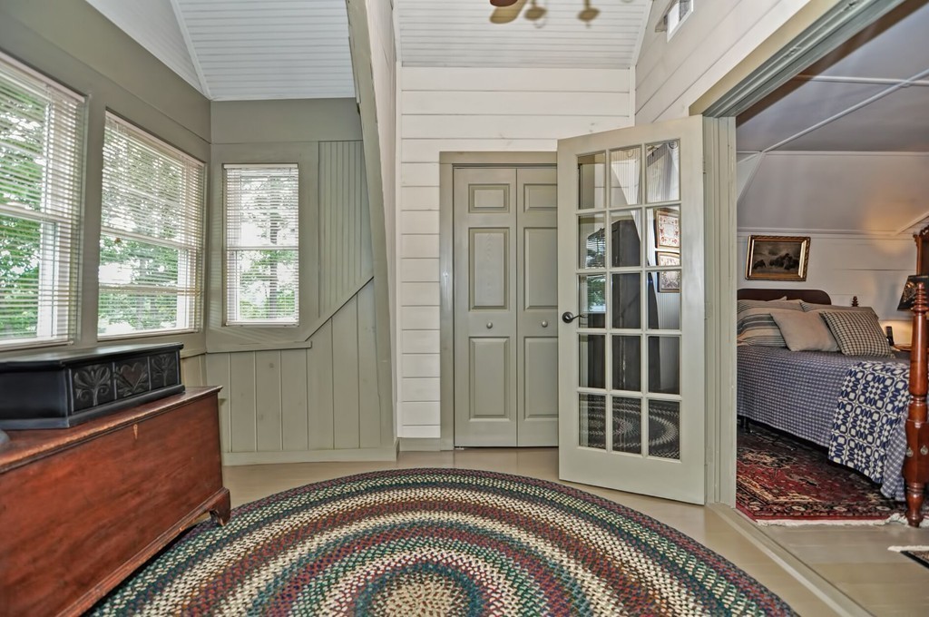 63 Wawela Park Road Webster, MA 01570 - Photo 24 of 30 a view of a bedroom with wooden floor and a window