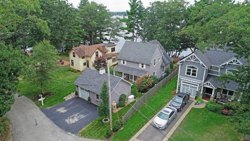 63 Wawela Park Road Webster, MA 01570 - Photo 3 of 30 an aerial view of a house with a big yard plants and large trees