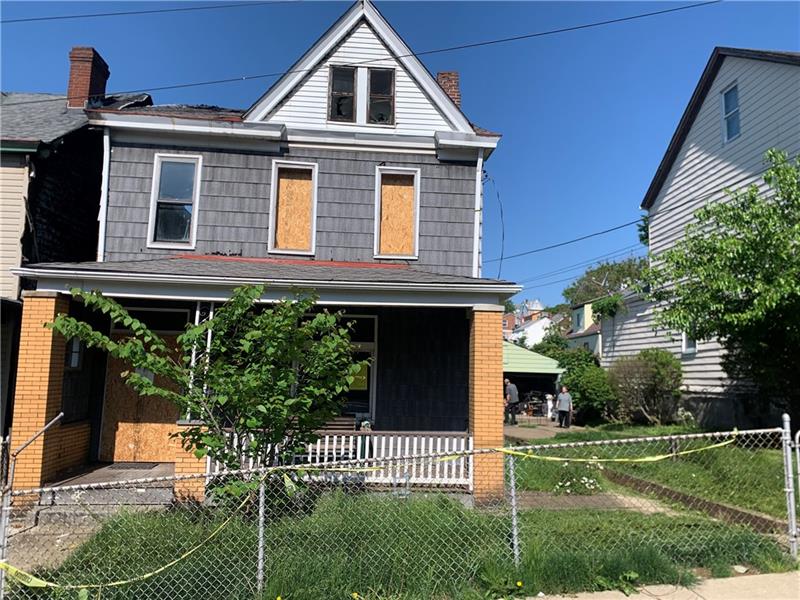 134 Rinne Street Pittsburgh, PA 15210 - Photo 1 of 23 a front view of a house with a yard
