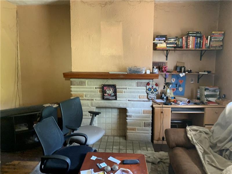134 Rinne Street Pittsburgh, PA 15210 - Photo 2 of 23 a living room with a couch and a table