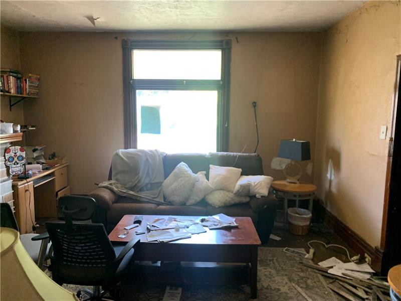 134 Rinne Street Pittsburgh, PA 15210 - Photo 3 of 23 a living room with furniture and a window