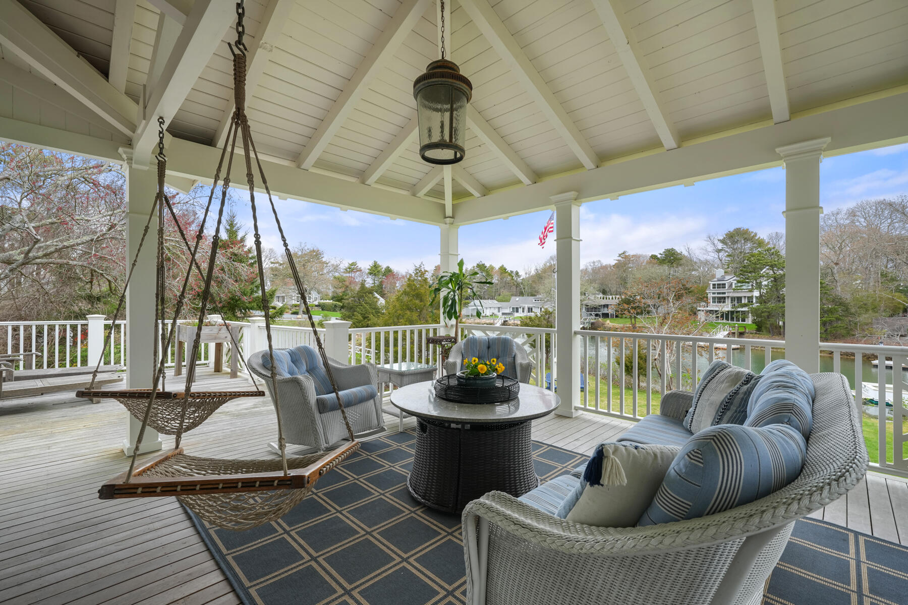 112 Wading Place Road Mashpee, MA 02649 - Photo 14 of 58 a view of a chair and tables in the balcony