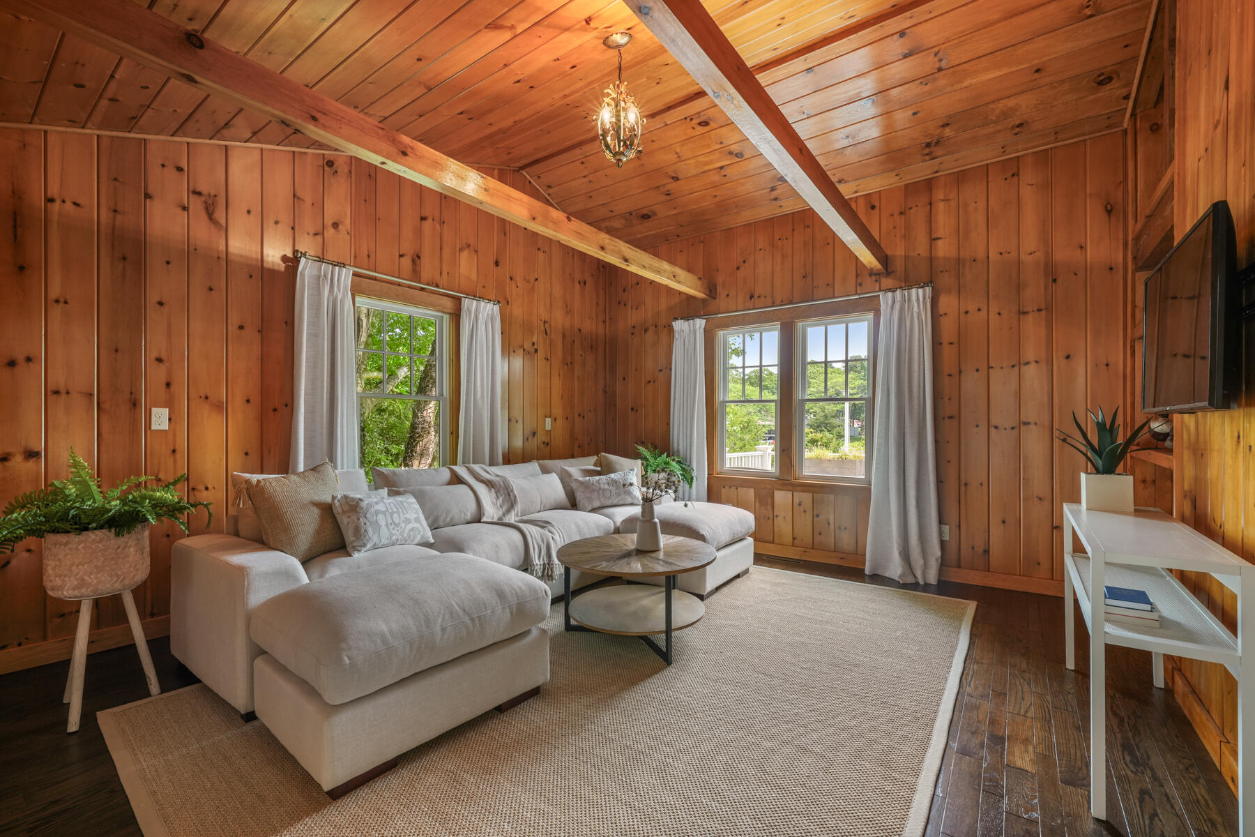 112 Wading Place Road Mashpee, MA 02649 - Photo 21 of 58 a living room with furniture and a flat screen tv