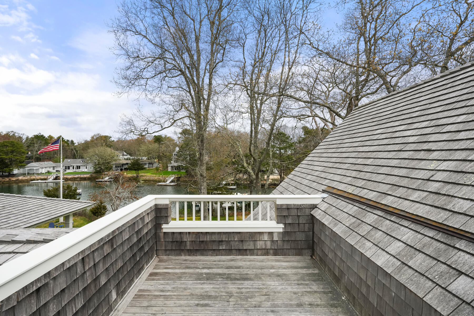 112 Wading Place Road Mashpee, MA 02649 - Photo 32 of 58 a view of a balcony with wooden floor and fence