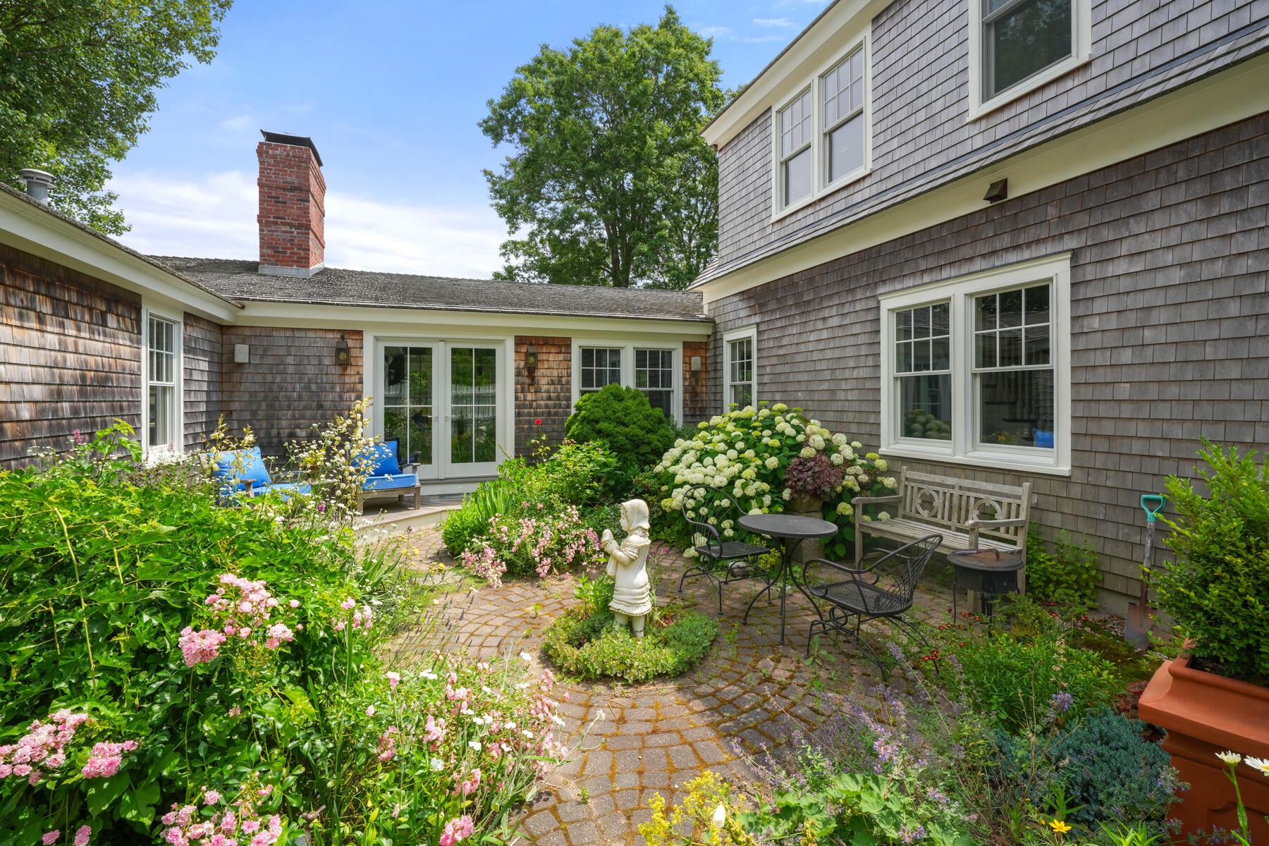 112 Wading Place Road Mashpee, MA 02649 - Photo 44 of 58 a front view of a house with garden