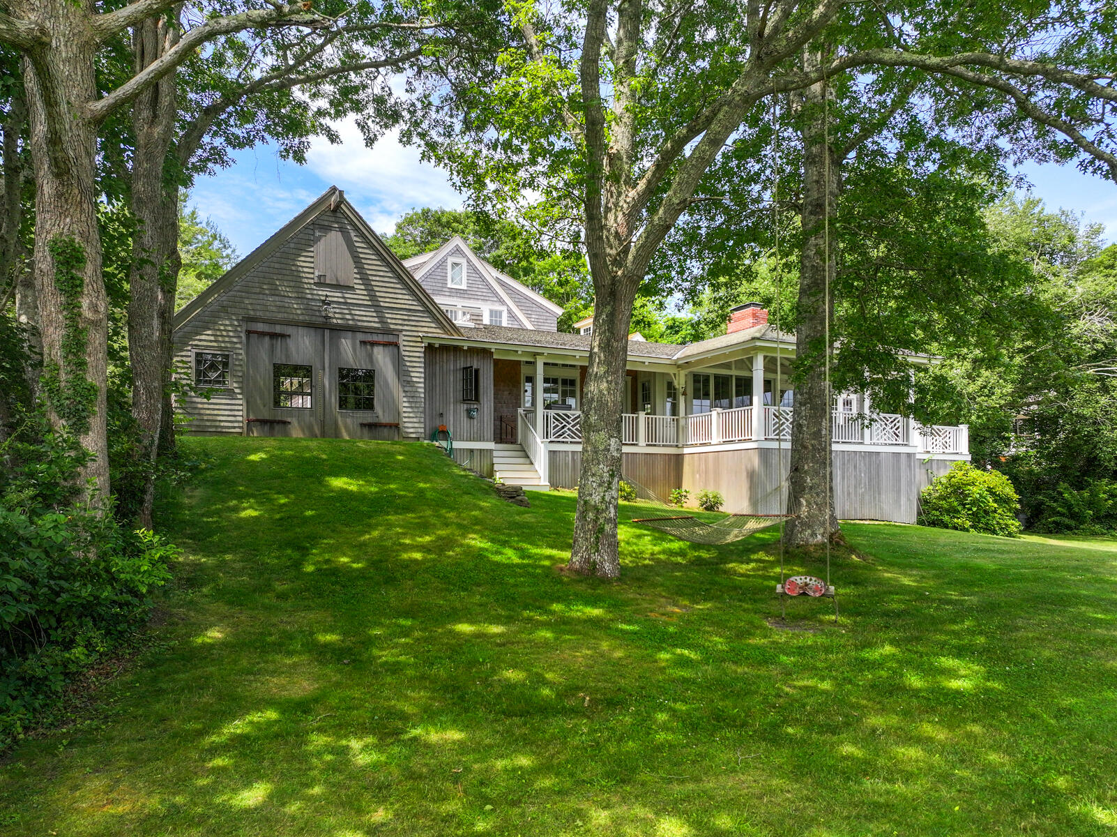 112 Wading Place Road Mashpee, MA 02649 - Photo 57 of 58 a front view of a house with a garden