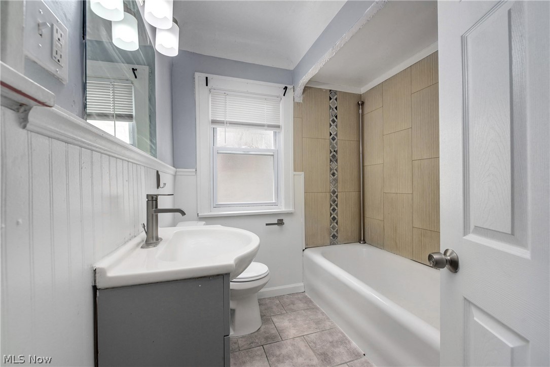 2115 Marlindale Road Cleveland Heights, OH 44118 - Photo 14 of 19 Full bathroom with tile patterned floors, vanity, tiled shower / bath, and toilet