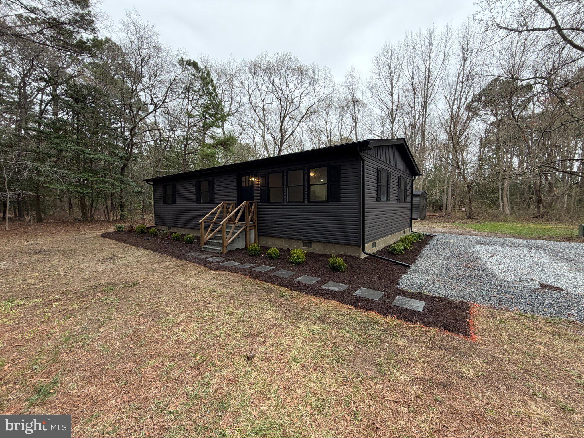 22206 Wetipquin Road Quantico, MD 21856 - Photo 1 of 19 Charming modern home in serene woods.