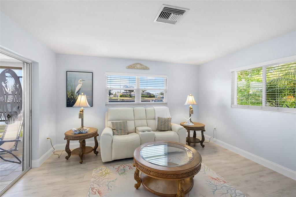 4151 Camelia Drive Hernando Beach, FL 34607 - Photo 11 of 37 a living room with furniture and a window