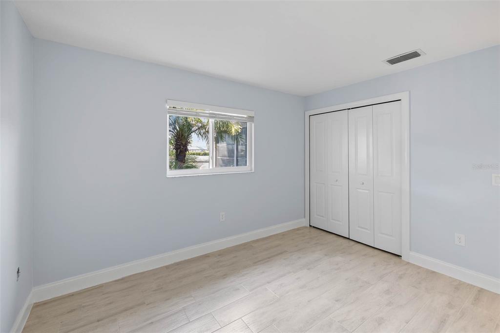 4151 Camelia Drive Hernando Beach, FL 34607 - Photo 20 of 37 a view of an empty room with closet and a window