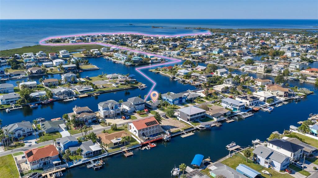4151 Camelia Drive Hernando Beach, FL 34607 - Photo 2 of 37 an aerial view of residential houses with outdoor space
