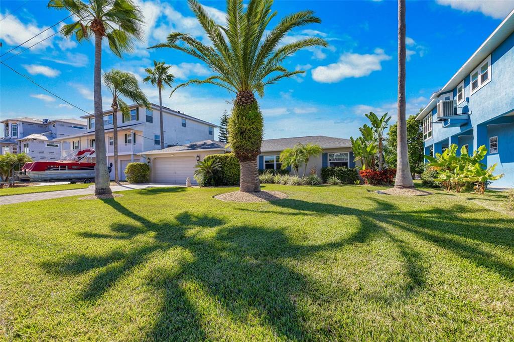 4151 Camelia Drive Hernando Beach, FL 34607 - Photo 27 of 37 a view of a house with a yard