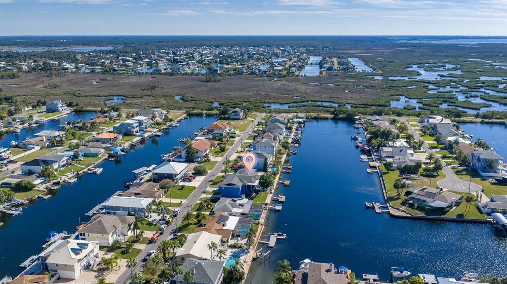 4151 Camelia Drive Hernando Beach, FL 34607 - Photo 31 of 37 an aerial view of residential houses with outdoor space