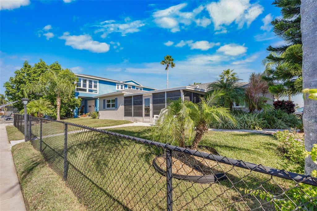 4151 Camelia Drive Hernando Beach, FL 34607 - Photo 7 of 37 a view of a house with a yard
