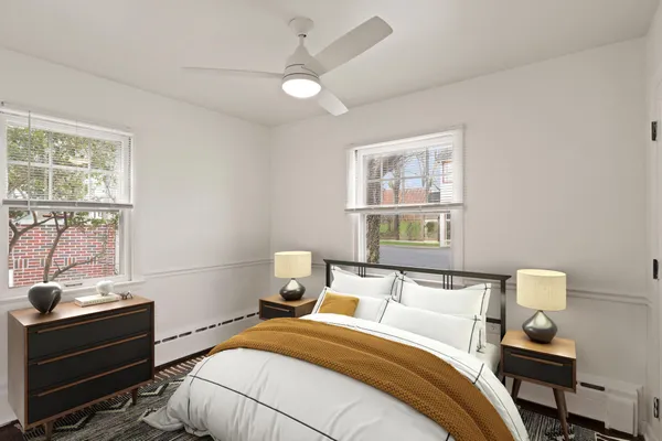 a bedroom with a bed and a window