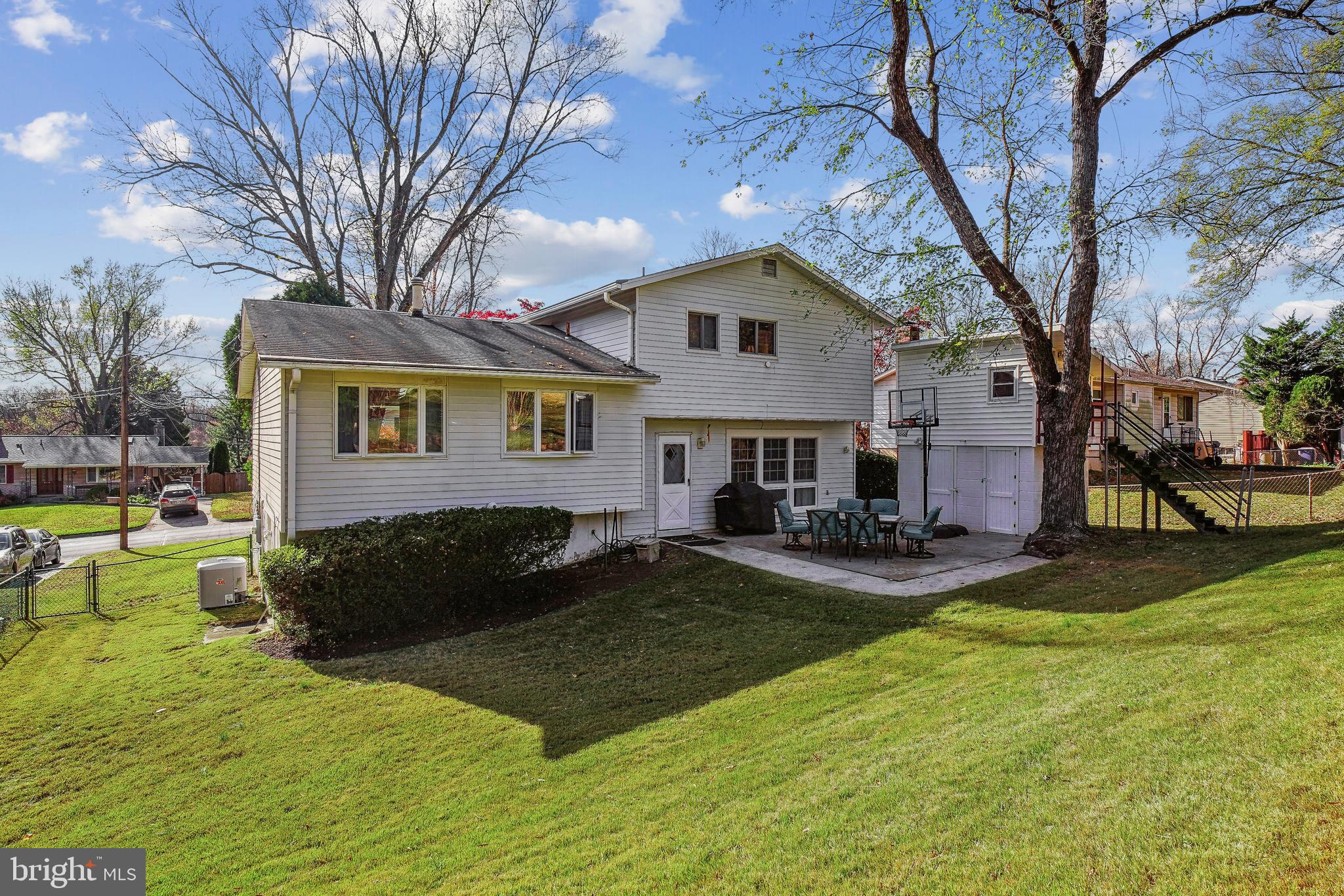 5405 Manorfield Road Rockville, MD 20853 - Photo 25 of 34 Rear of home with expansive lawn; note playhouse