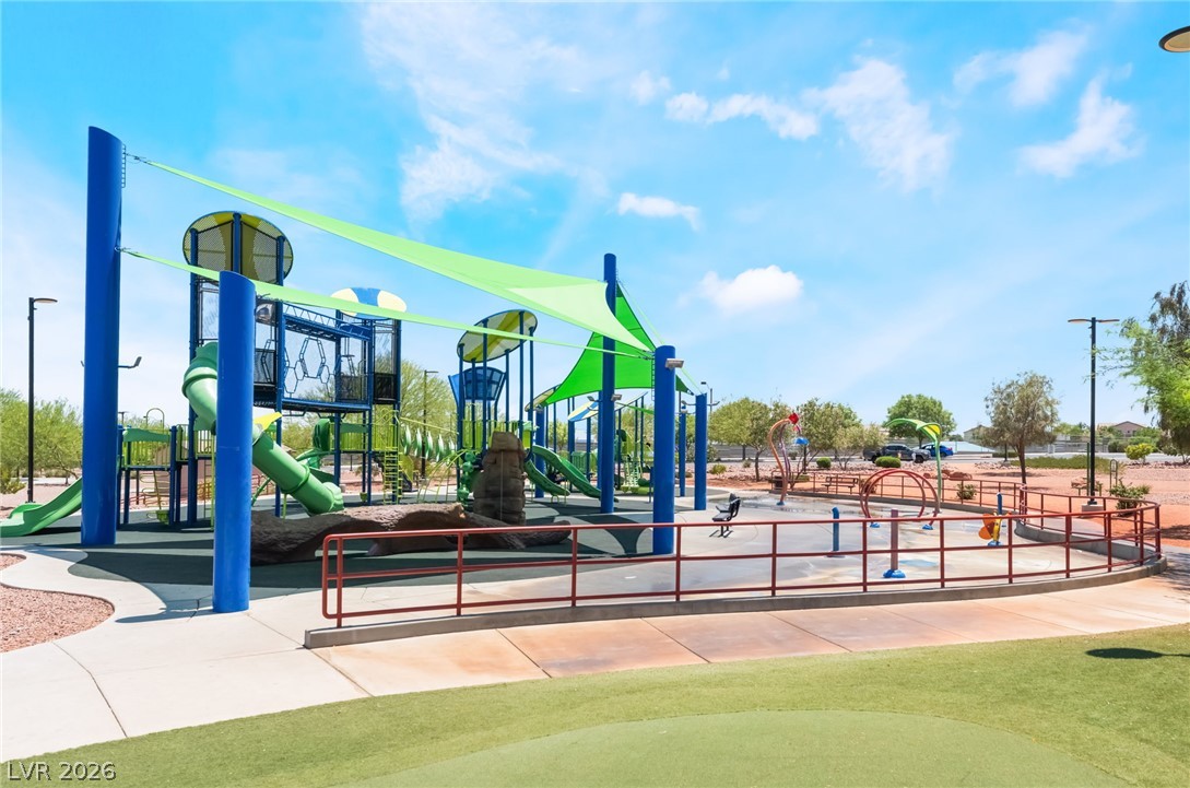 6432 Spring Jog Street Las Vegas, NV 89166 - Photo 44 of 61 A vibrant community playground with shaded structures for endless outdoor enjoyment.