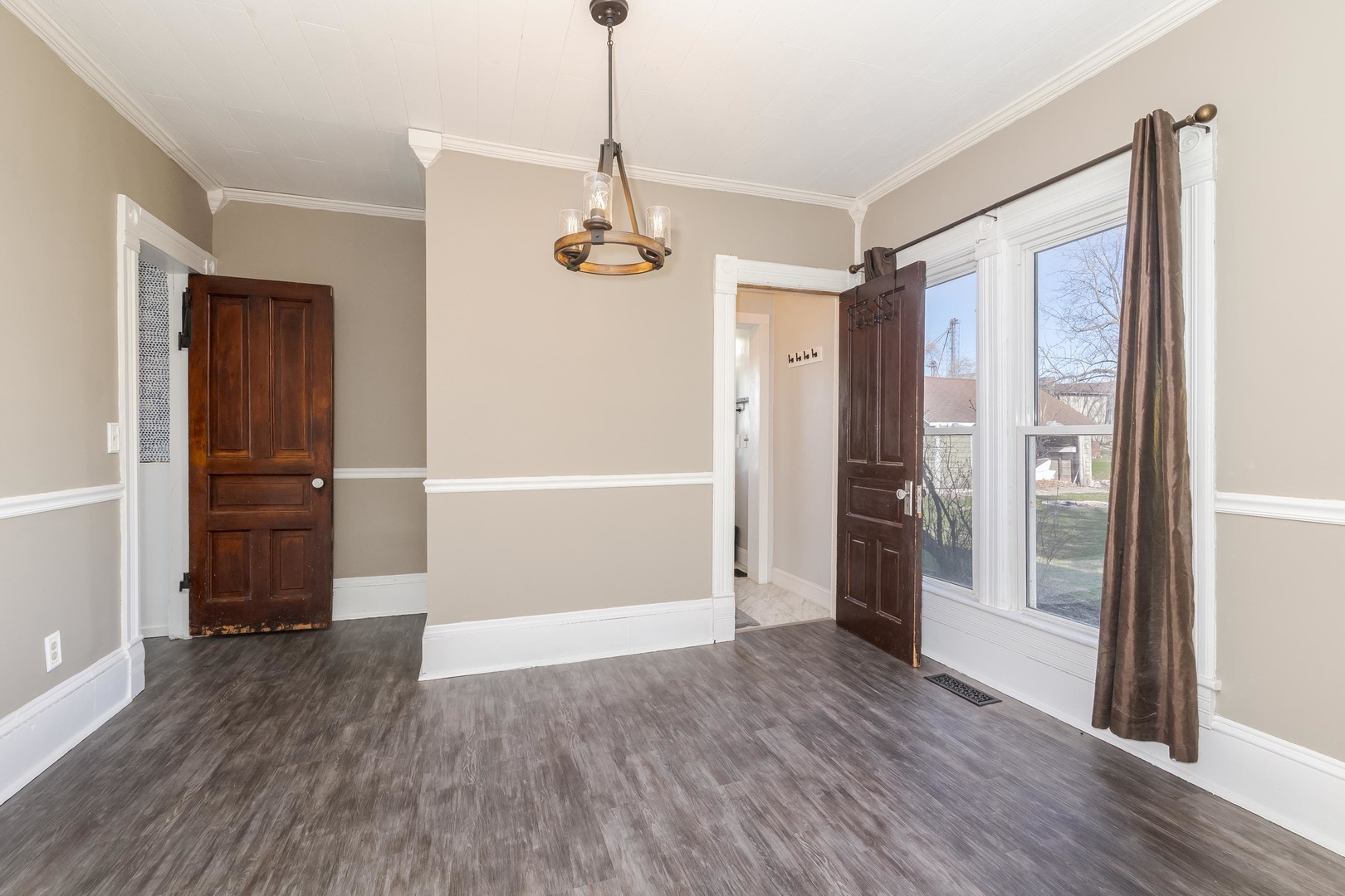 26 Lafayette Street Saunemin, IL 61769 - Photo 17 of 38 a view of empty room with wooden floor and window