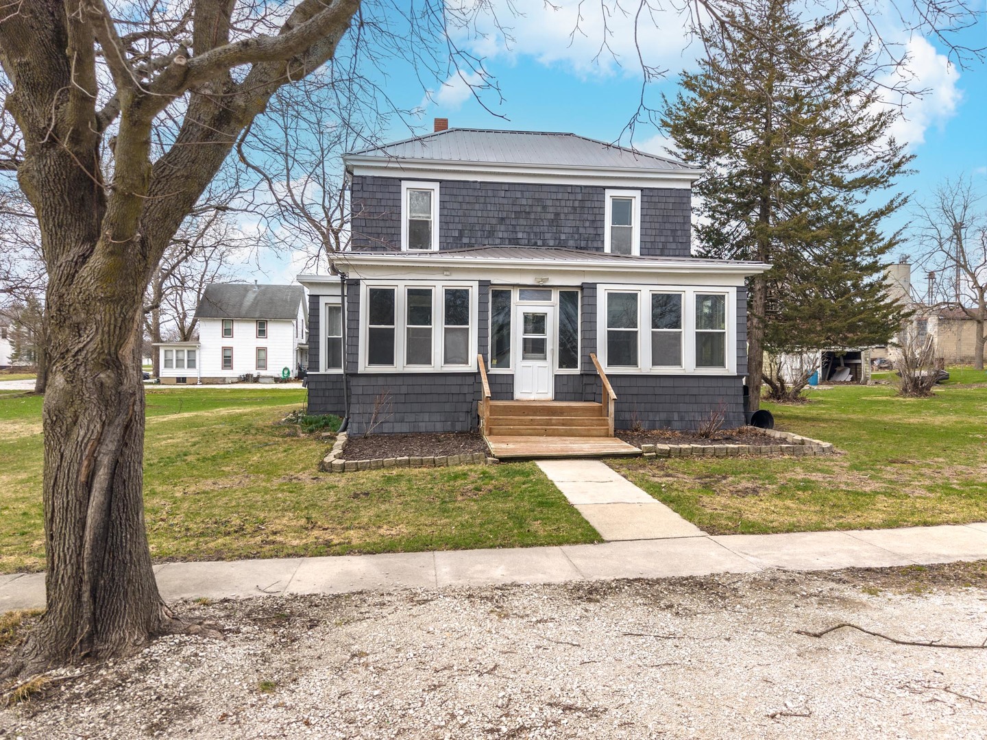26 Lafayette Street Saunemin, IL 61769 - Photo 2 of 38 a view of a house with a yard