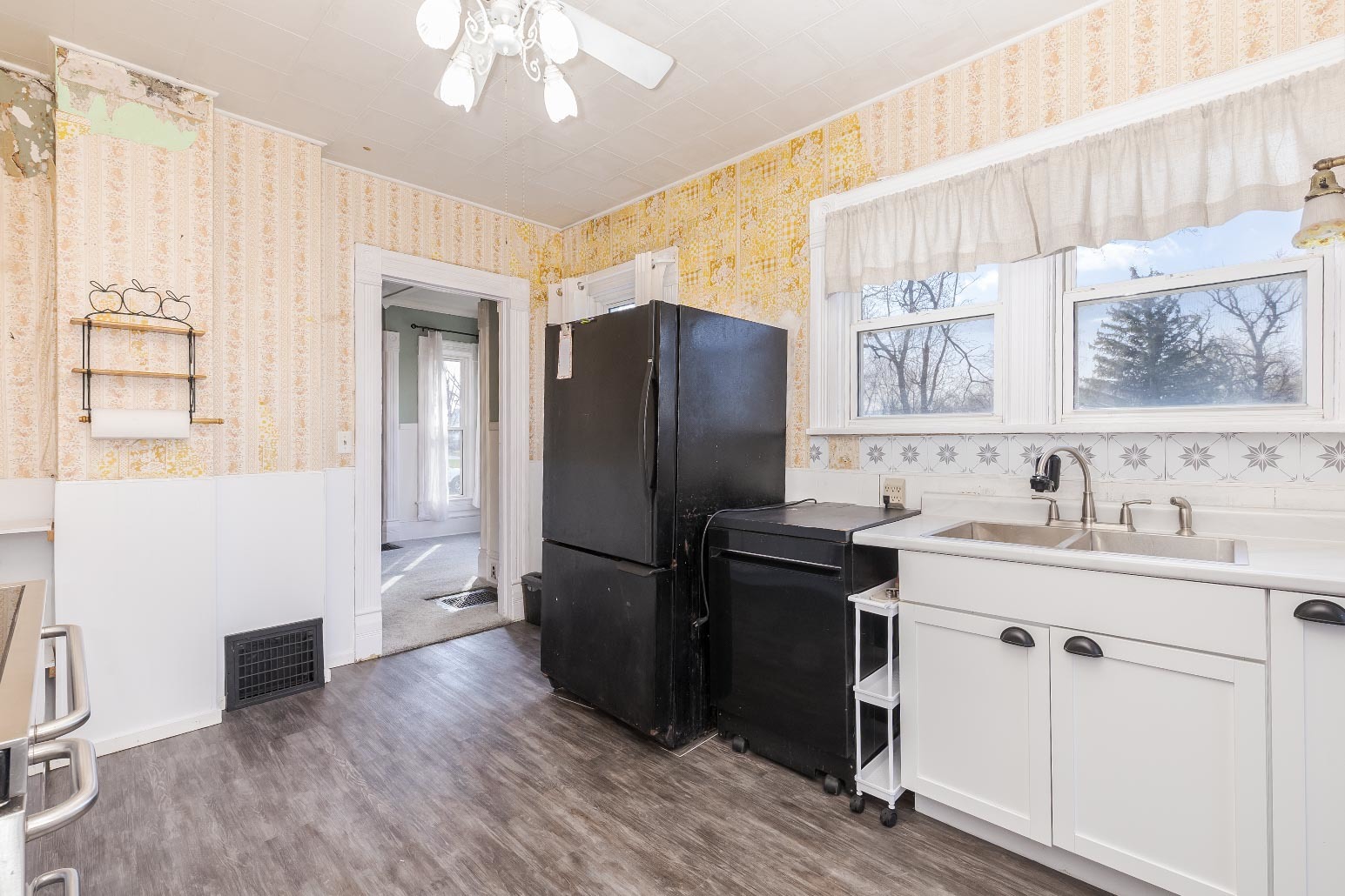 26 Lafayette Street Saunemin, IL 61769 - Photo 21 of 38 a kitchen with a refrigerator and a sink