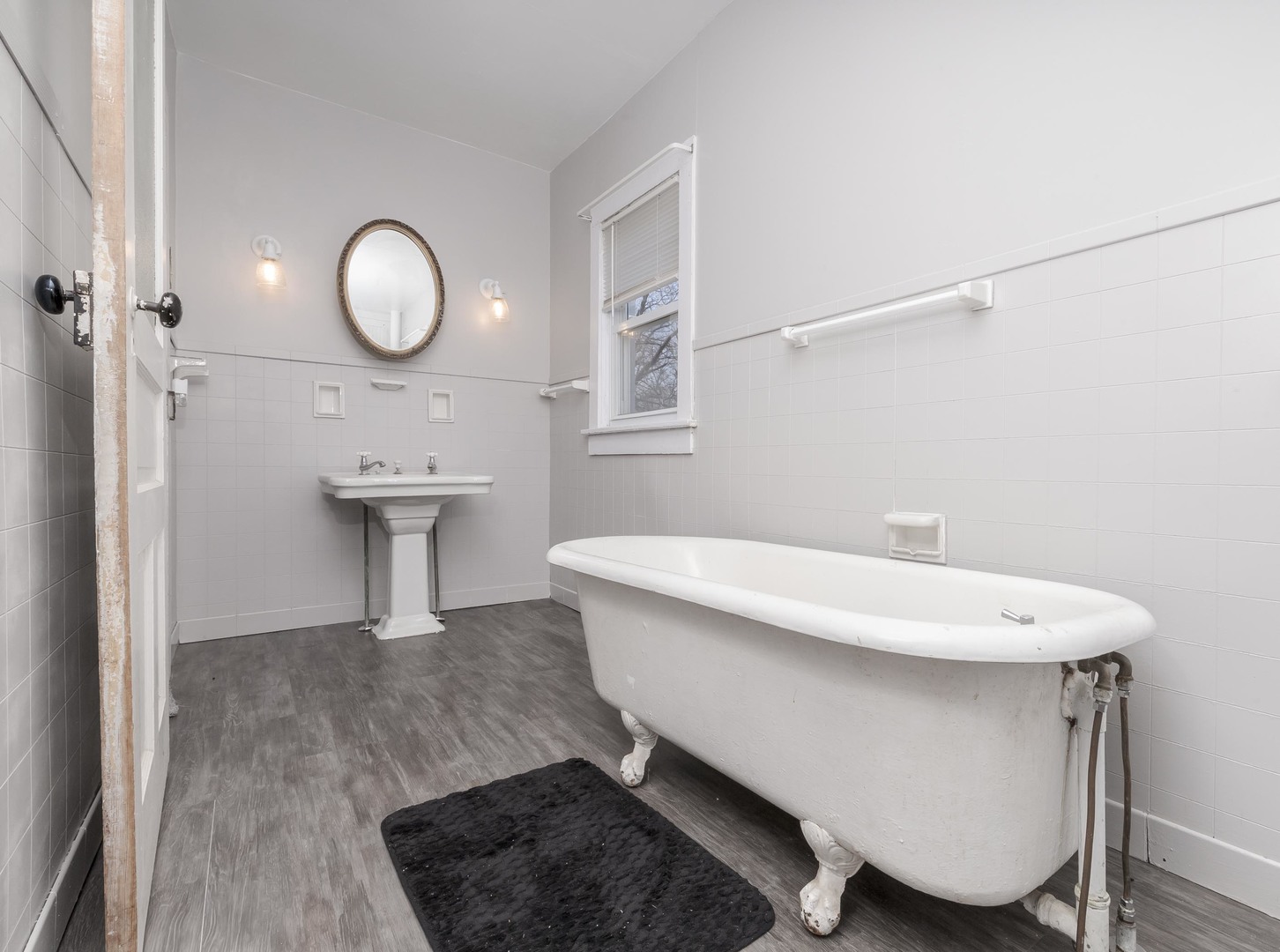 26 Lafayette Street Saunemin, IL 61769 - Photo 28 of 38 a bathroom with a sink mirror and toilet