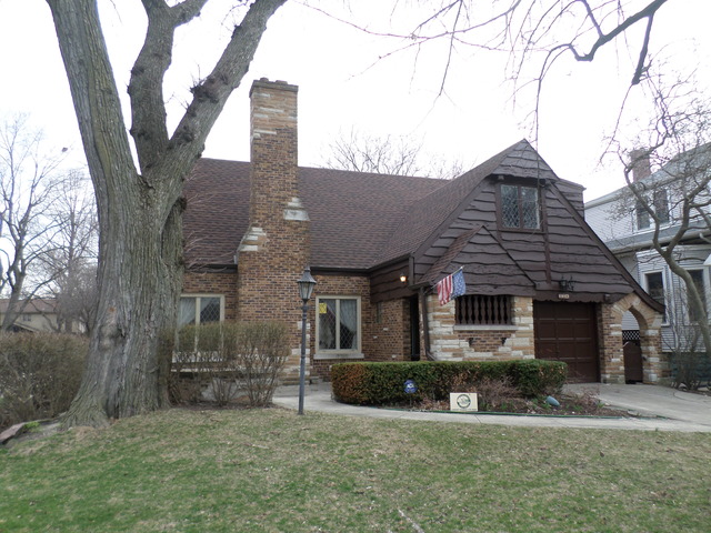 334 Downing Road Riverside, IL 60546 - Photo 1 of 23 a front view of a house with a yard