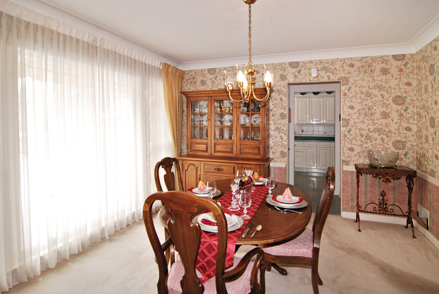 334 Downing Road Riverside, IL 60546 - Photo 4 of 23 a view of a dining room with furniture and chandelier