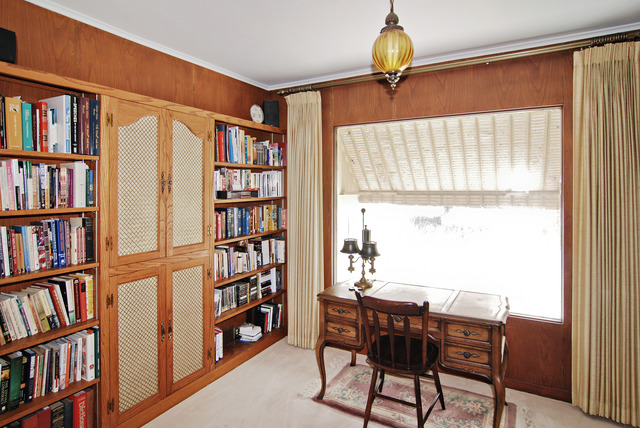 334 Downing Road Riverside, IL 60546 - Photo 5 of 23 a view of a workspace with bookshelf