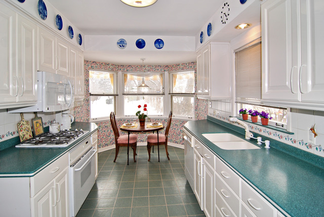 334 Downing Road Riverside, IL 60546 - Photo 6 of 23 a kitchen with a sink stove and dining table