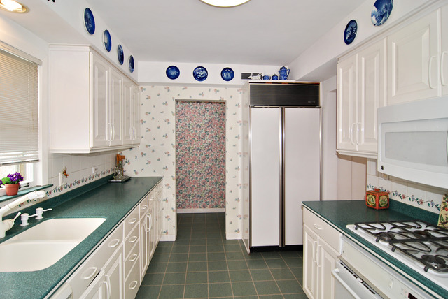 334 Downing Road Riverside, IL 60546 - Photo 7 of 23 a kitchen with stainless steel appliances a sink stove and cabinets