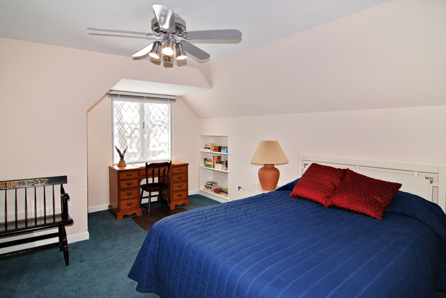 334 Downing Road Riverside, IL 60546 - Photo 10 of 23 a bedroom with a bed and a chandelier