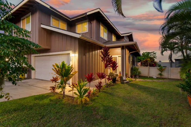 a front view of house with yard outdoor seating and green space