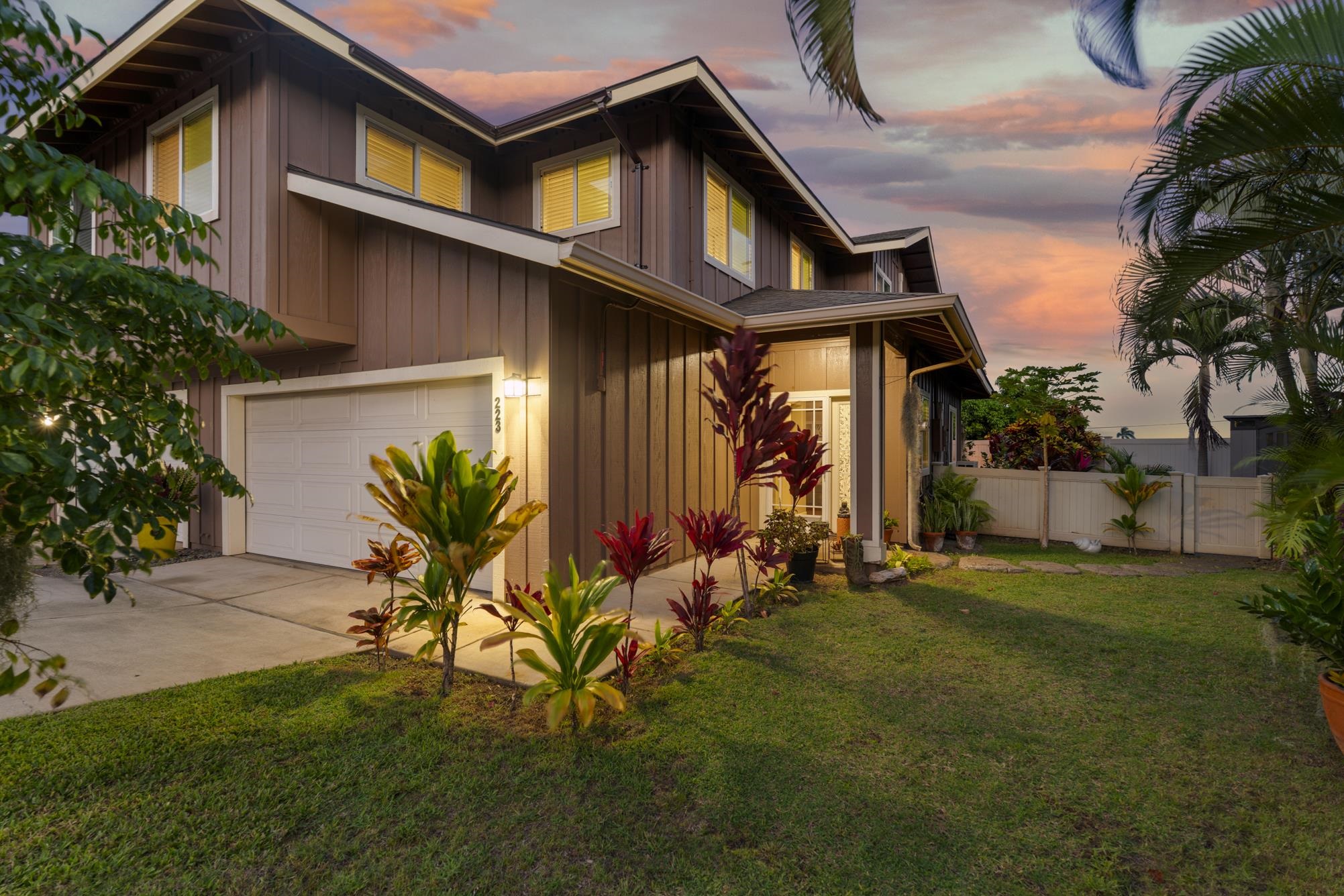 a front view of house with yard outdoor seating and green space