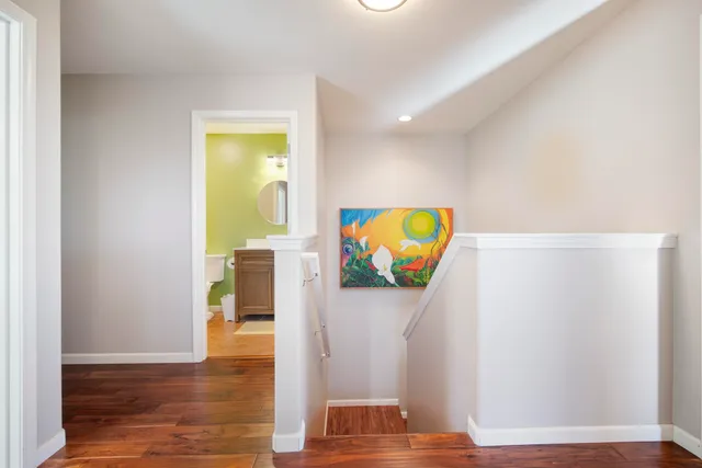 a view of room with window and wooden floor
