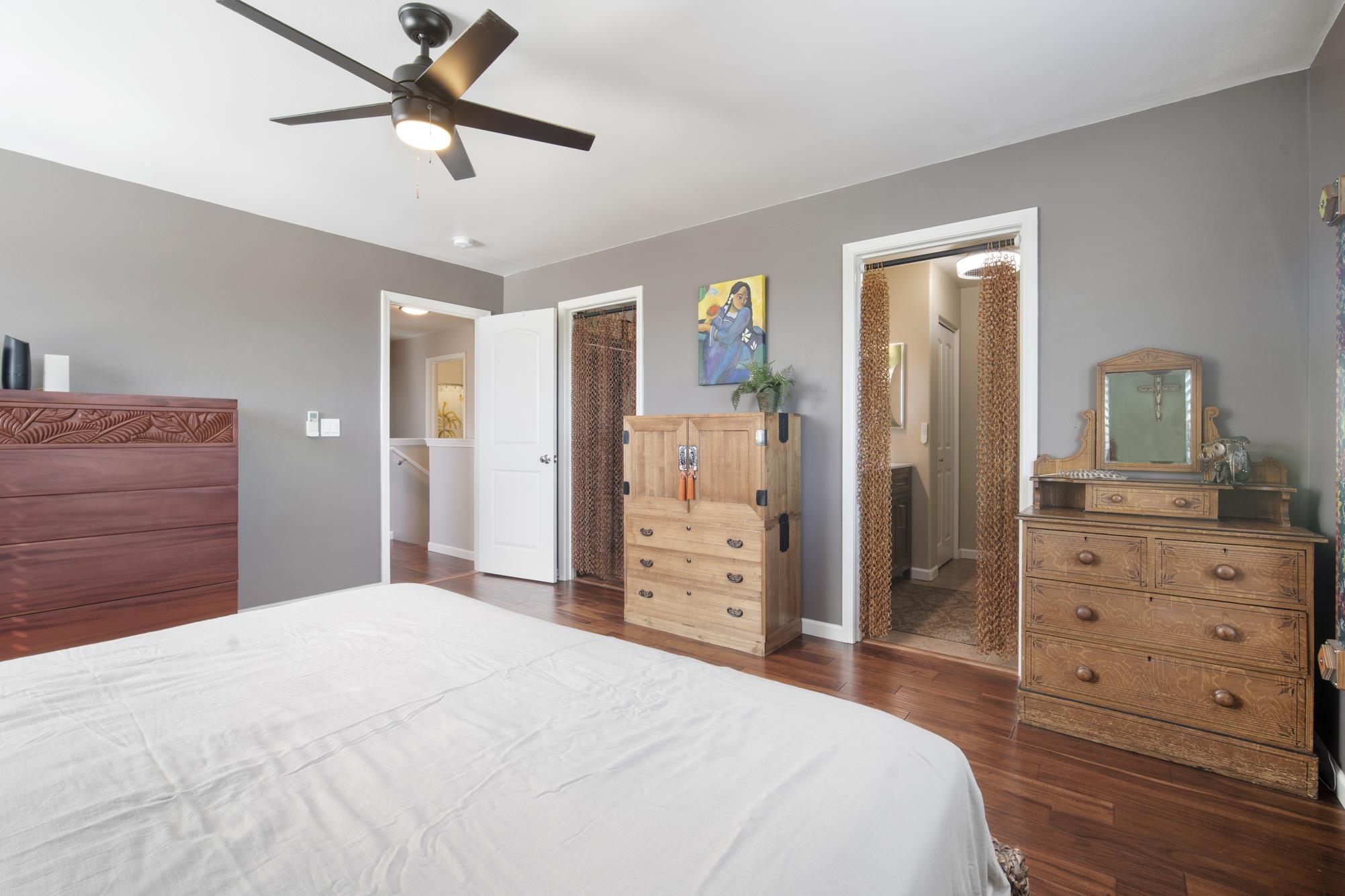 223 Lau Oliwa Loop, Unit 38 Wailuku, HI 96793 - Photo 22 of 50 a bedroom with a bed and a dresser