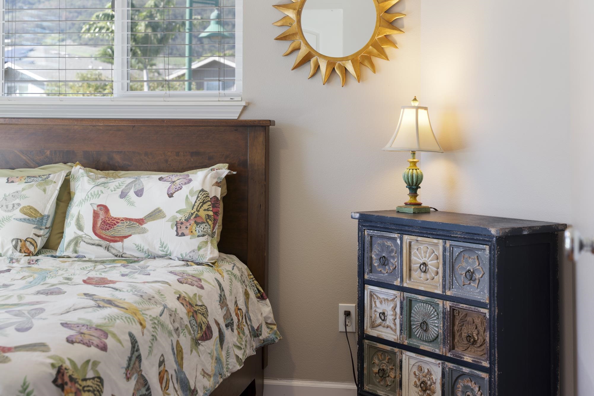 223 Lau Oliwa Loop, Unit 38 Wailuku, HI 96793 - Photo 24 of 50 a bed room with a bed and a painting on the wall