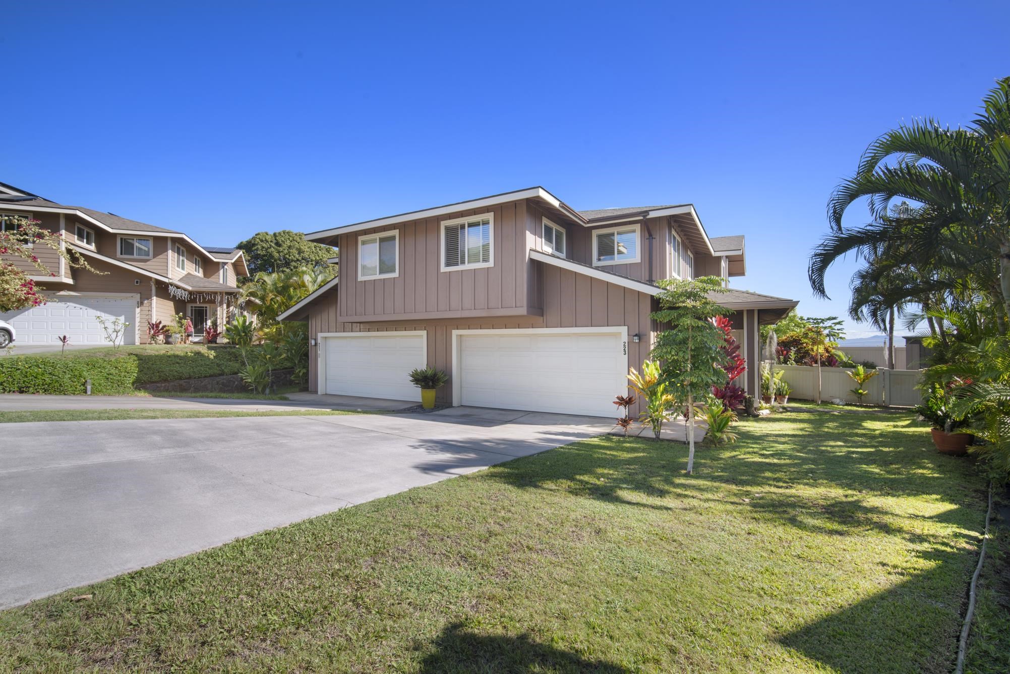 223 Lau Oliwa Loop, Unit 38 Wailuku, HI 96793 - Photo 48 of 50 a front view of house with yard and trees in the background