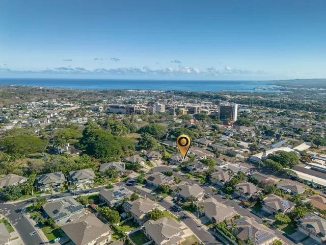 an aerial view of a house with a yard basket ball court and outdoor seating