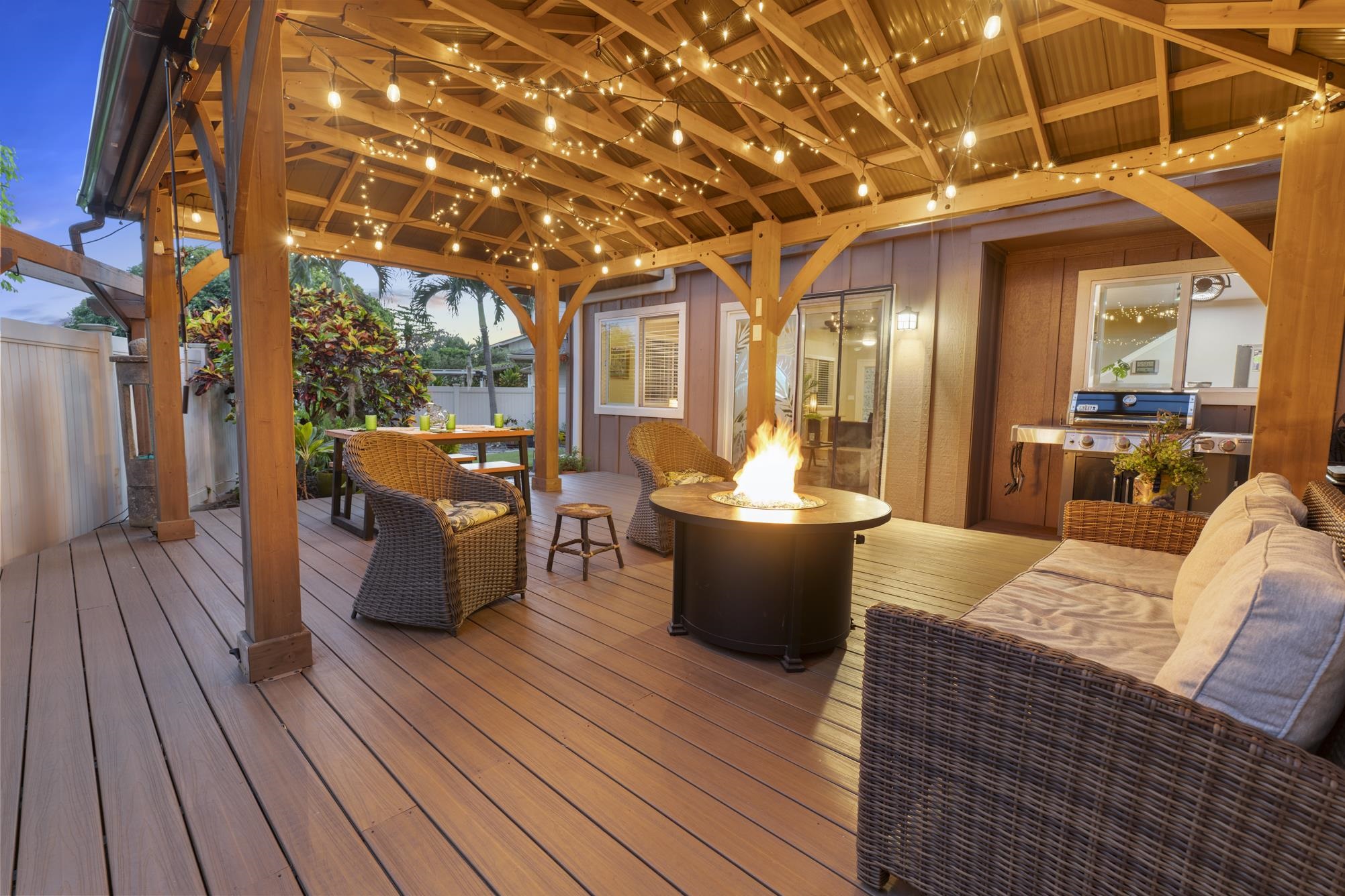 223 Lau Oliwa Loop, Unit 38 Wailuku, HI 96793 - Photo 5 of 50 a view of a patio with couches dining table and chairs with wooden floor