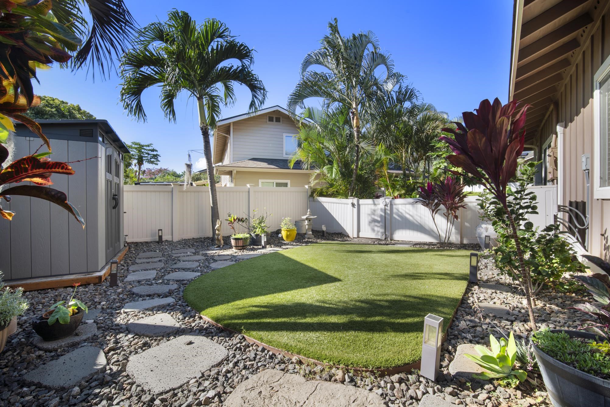 223 Lau Oliwa Loop, Unit 38 Wailuku, HI 96793 - Photo 6 of 50 a front view of a house with garden