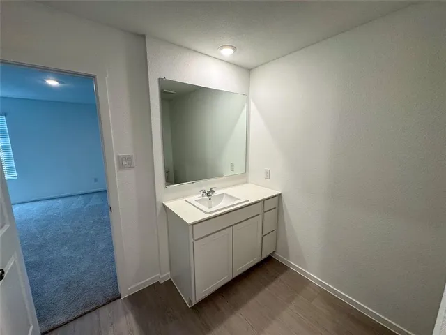 a bathroom with a sink and mirror