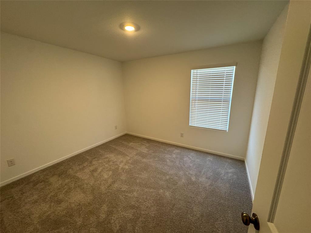3915 Selawik Street Sherman, TX 75090 - Photo 15 of 19 an empty room with a window