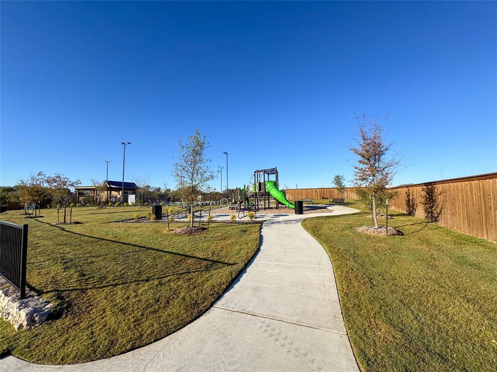 3915 Selawik Street Sherman, TX 75090 - Photo 18 of 19 a view of a swimming pool with an outdoor seating