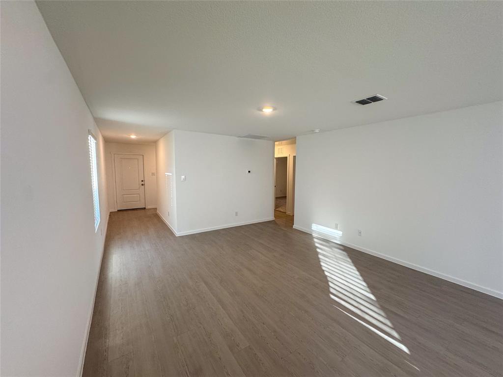 3915 Selawik Street Sherman, TX 75090 - Photo 7 of 19 a view of a livingroom with wooden floor