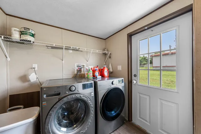 a view of storage and utility room with washer and dryer
