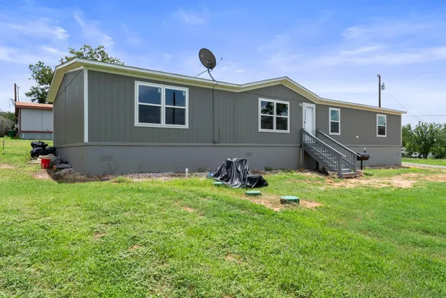 a house view with a garden space